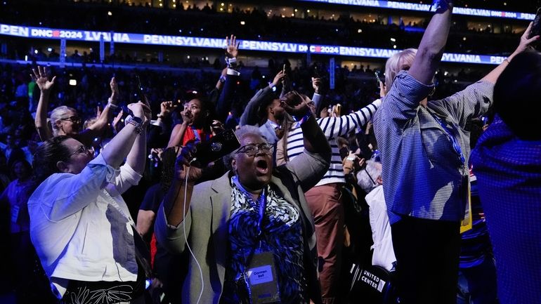 Pennsylvania delegates react during roll call of the state at...