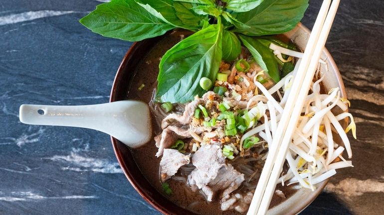 Beef pork boat noodle soup with Chinese broccoli, bean sprouts,...