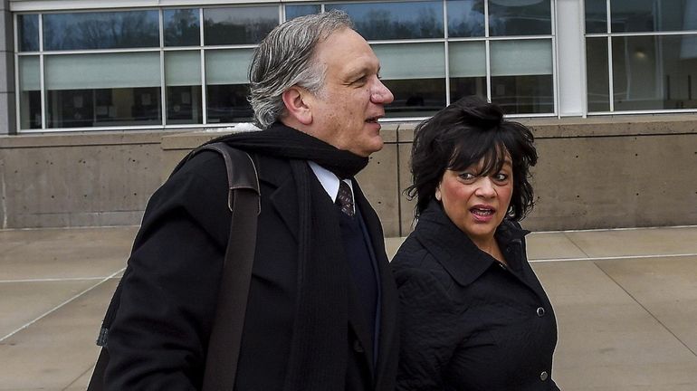 Edward and Linda Mangano arrive at federal court in Central...