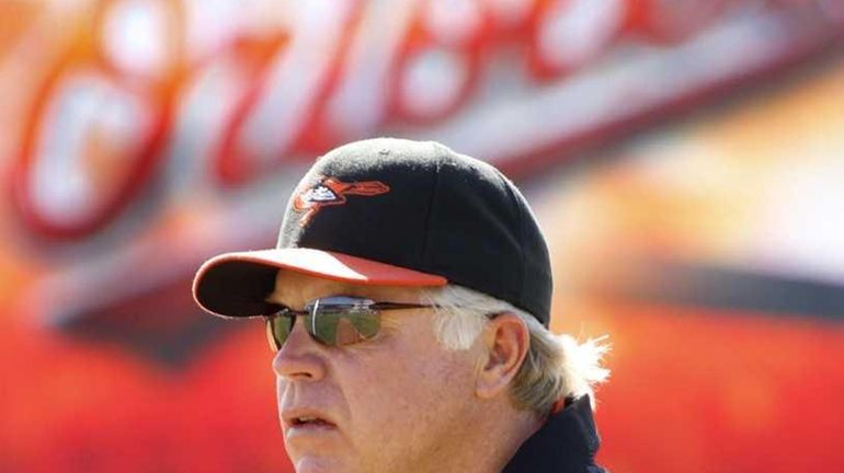 Baltimore Orioles manager Buck Showalter watches batting practice before a...