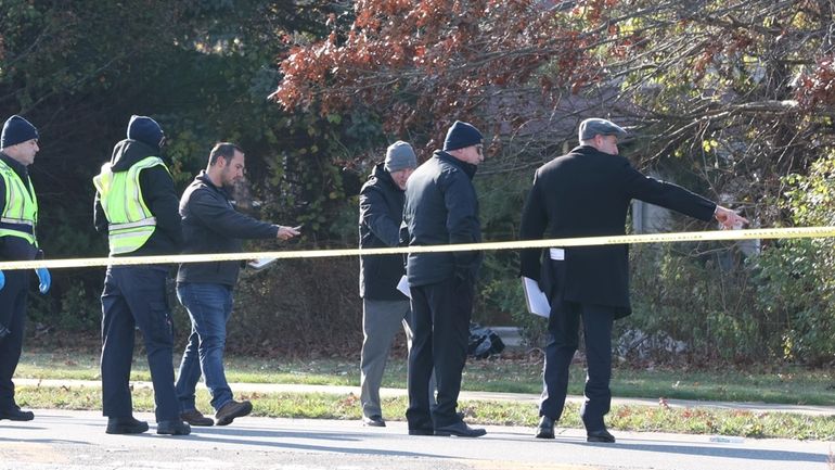 Suffolk County police investigate the scene of deadly crash on...