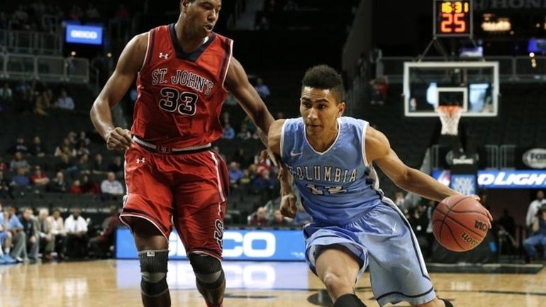 Columbia's Maodo Lo (12) drives to the basket as St....