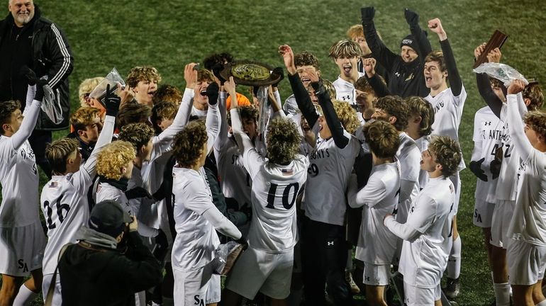 St. Anthony's celebrate its victory over Regis in the CHSAA boys...