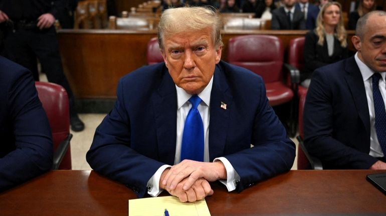 Former president Donald Trump at Manhattan Criminal Court on Monday...