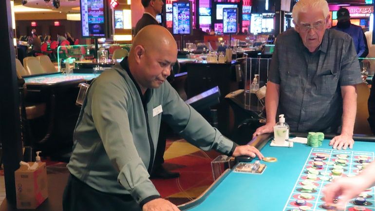 A dealer conducts a game of roulette at the Tropicana...