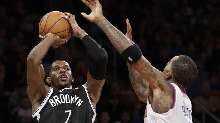 Brooklyn Nets guard Joe Johnson shoots a 3-pointer over New...