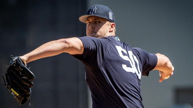 Yankees starting pitcher Jameson Taillon throwing in the top of the...