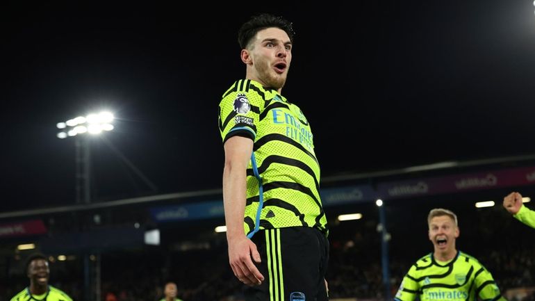 Arsenal's Declan Rice celebrates after scoring his side's fourth goal...