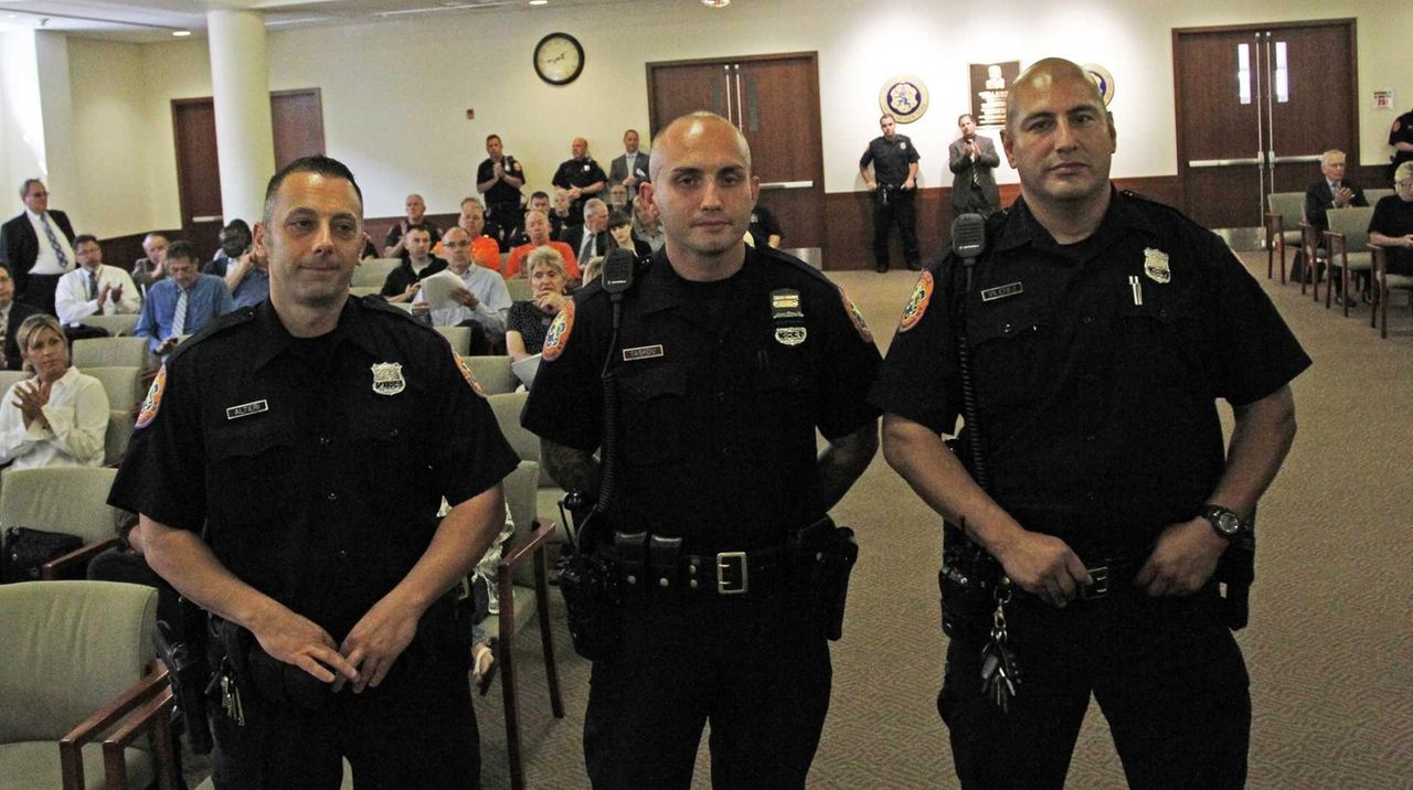 Three Nassau police officers honored for catching suspected robber of