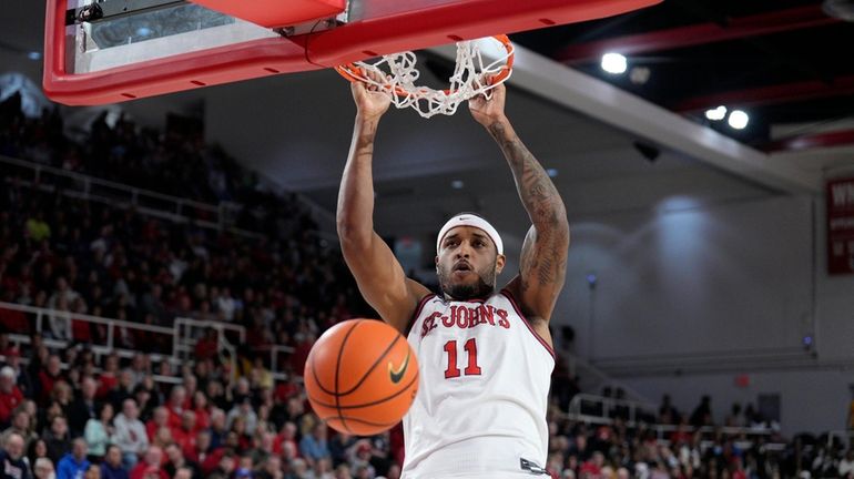 Joel Soriano of St. John's scores during a game against Holy...