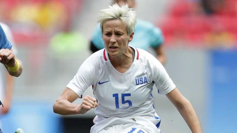 United States' Megan Rapinoe, kicks the ball past Sweden's Lisa...