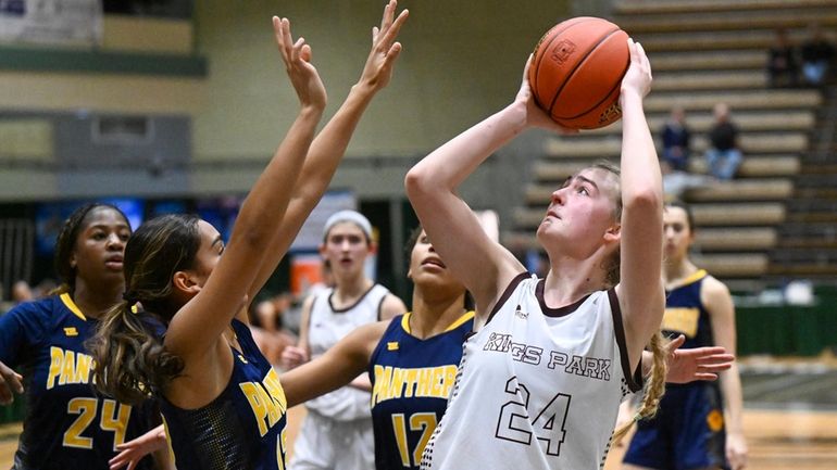 Kings Park's Ryan Currier shoots the ball against Walter Panas during the...