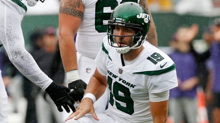 Joe Flacco #19 of the New York Jets looks on...