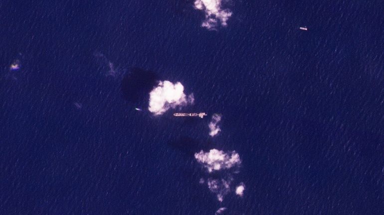 This satellite photo from Planet Labs PBC shows the USNS...