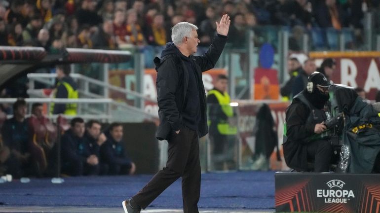 Roma's head coach Jose Mourinho gives directions to his players...