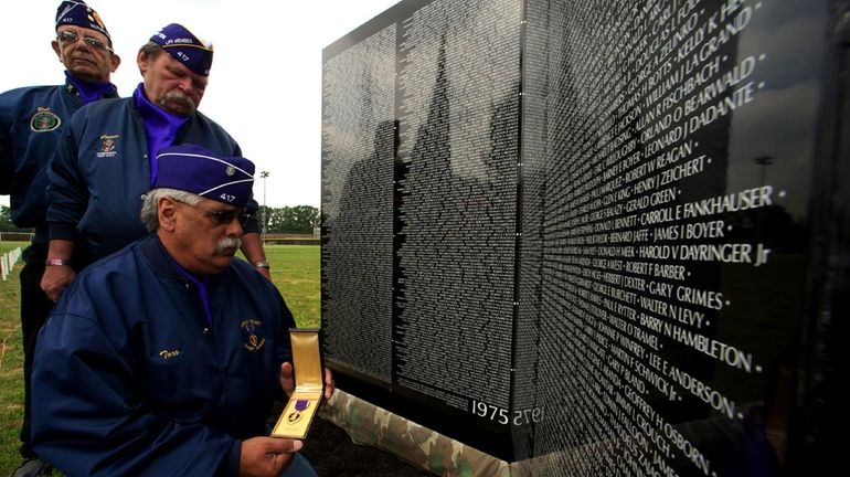 At Greis Veterans Park in Lynbrook, Robert Chiappone, left, Connie...