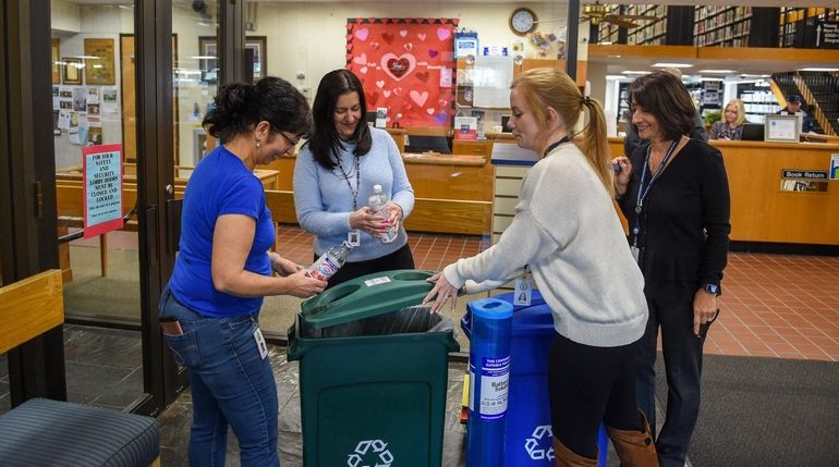 The Lindenhurst Memorial Library "Green Team," from left, Joan Dilluvio,...