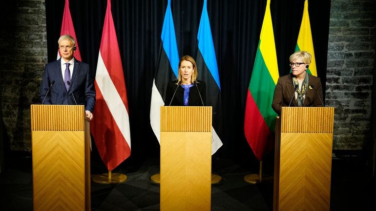 From left, then-Latvian Prime Minister Krisjanis Karins, Estonian Prime Minister...