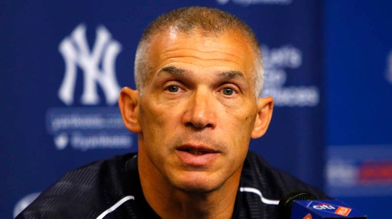 Manager Joe Girardi of the New York Yankees speaks to...