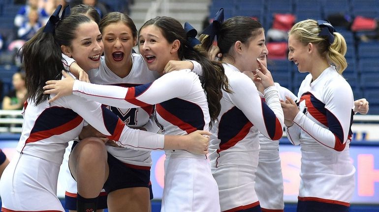MacArthur cheerleaders react after the conclusion of their routine in...