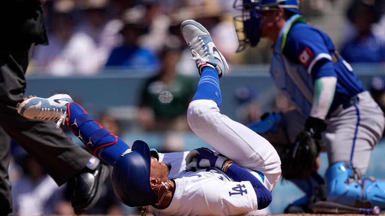 Dodgers star Mookie Betts suffers broken left hand when hit by a