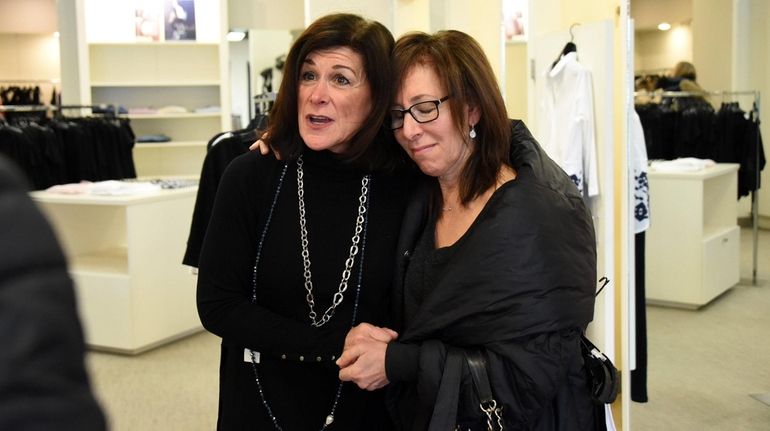 Longtime customer Audrey Halpern-Rosenberg of Dix Hills, right, shares an...