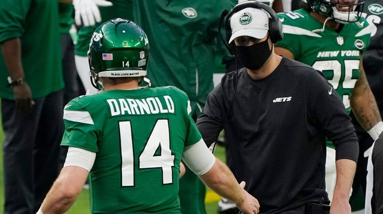 Jets head coach Adam Gase shakes hands with quarterback Sam...