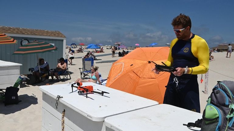 Lifeguard and drone operator Colin Hickey gets set to launch...