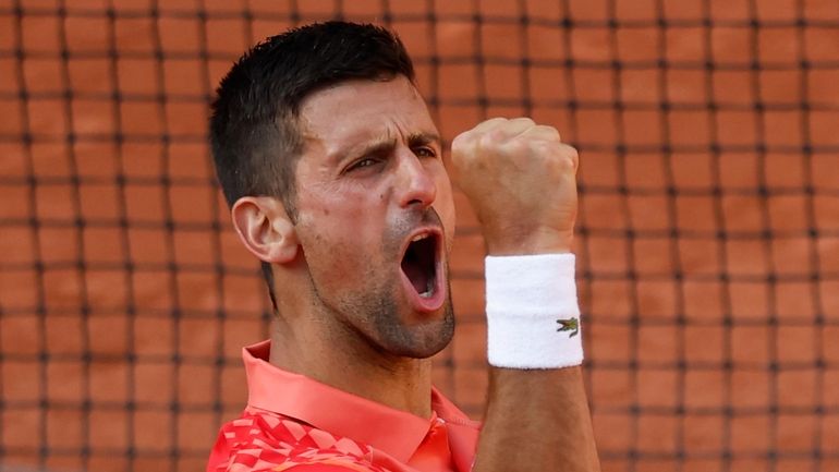 Serbia's Novak Djokovic celebrates winning his quarterfinal match of the...