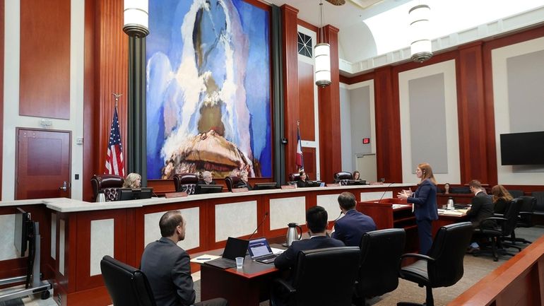 Taylor Meehan, right, an attorney for the Utah Legislature, defends...