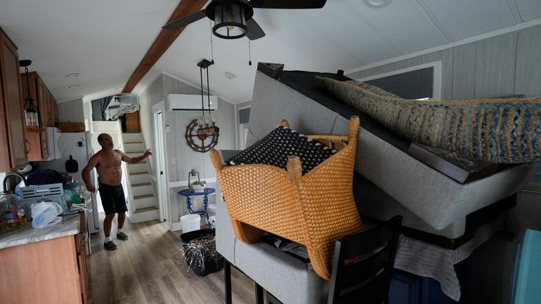 Furniture is piled high inside a canal-front second home of...