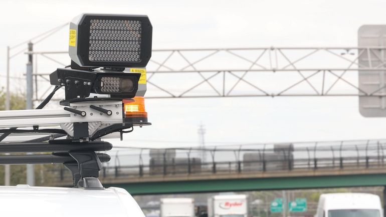 A speed camera mounted on an sport ulility vehicle along...