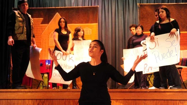 Margarita Espada, center, of Teatro Experimental Yerbabruja performs in the...