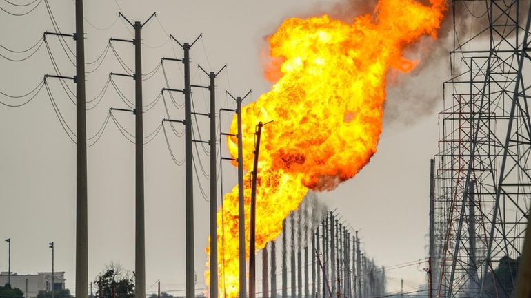 A pipeline carrying liquified natural gas burns near Spencer Highway...