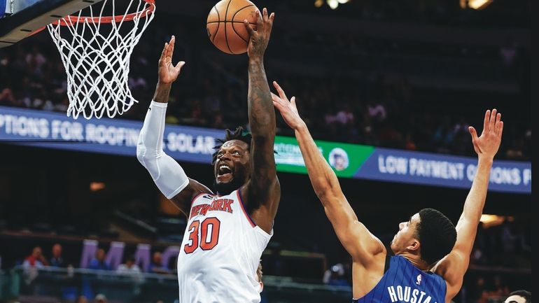 Knicks forward Julius Randle (30) misses a slam as he...