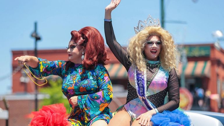 Pageant winners throw out beads during the Memphis PRIDE Festival...