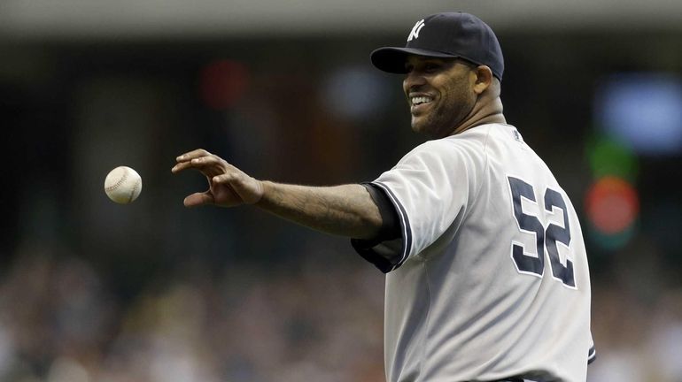 CC Sabathia of the Yankees pitches in the bottom of...