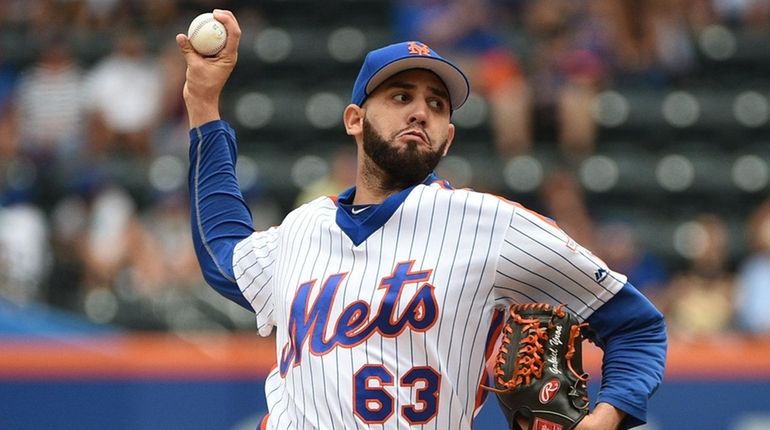 New York Mets starting pitcher Gabriel Ynoa delivers a pitch...