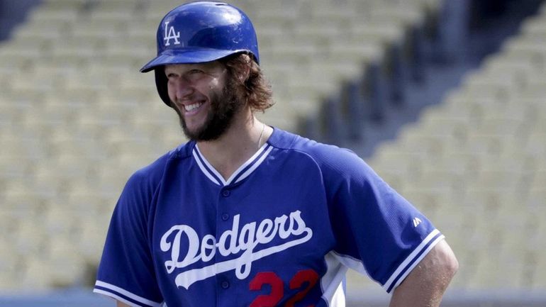 Los Angeles Dodgers starting pitcher Clayton Kershaw looks on during...