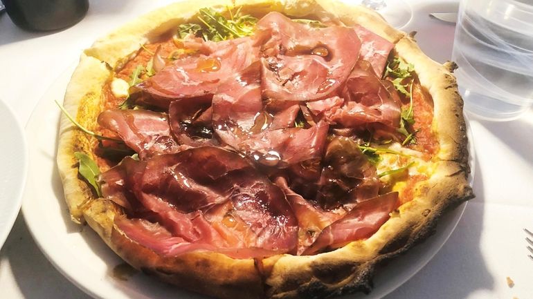 Pizza topped with Wagyu bresaola at Stellina Ristorante, a new...