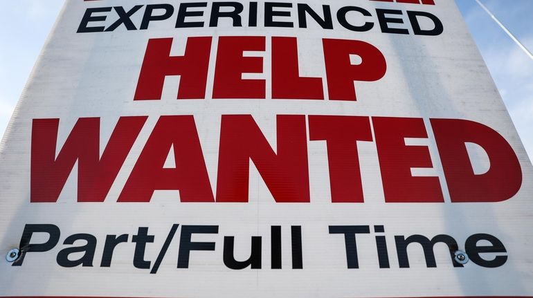 A help wanted sign on the north service road of...