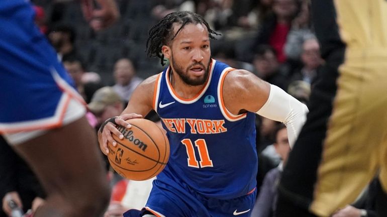 Knicks guard Jalen Brunson (11) drives at the Toronto Raptors...