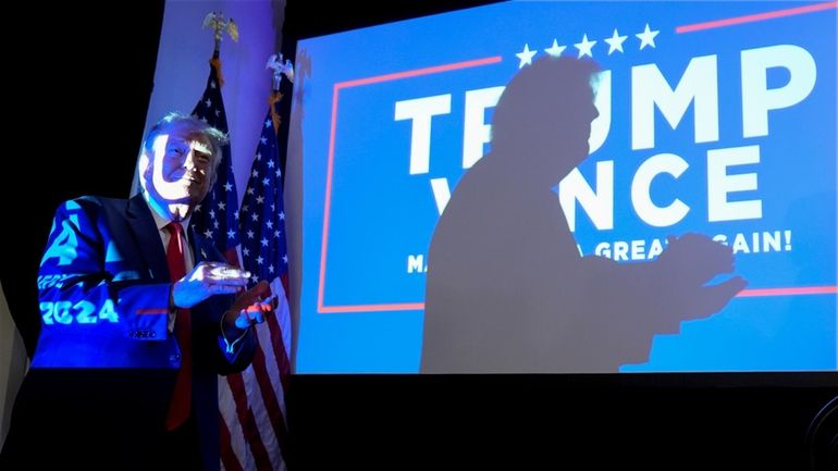 Republican presidential nominee former President Donald Trump arrives to speak...