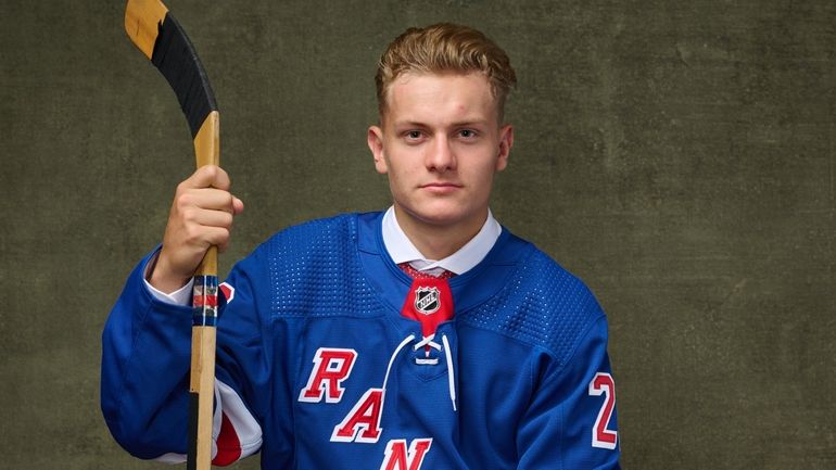 Adam Sykora, No. 63 pick by the Rangers, poses for a...