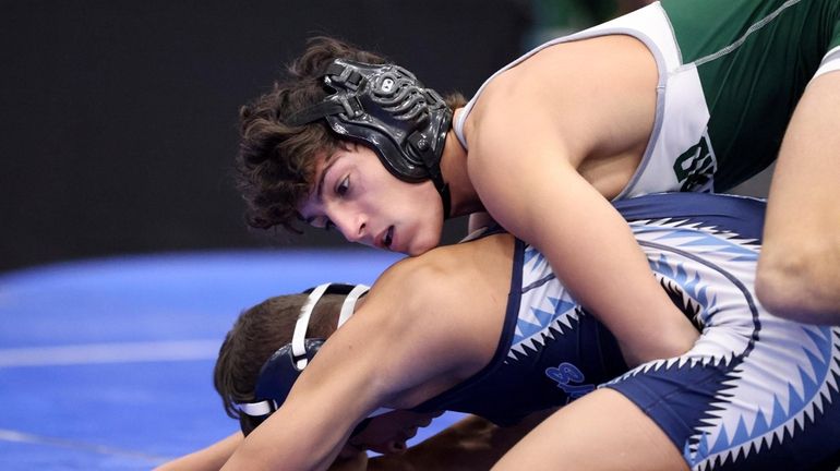 Seaford;'s Jack Godoy wrestles Saugerties' Jonathan Hernandez during a 132-pound bout...