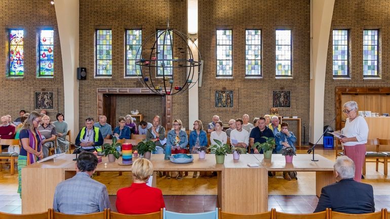 Laywomen Nancy Speeckaert, left, and Marijke Devaddere, right, lead a...