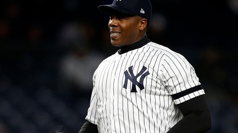 Yankees closer Aroldis Chapman reacts on the mound during the...