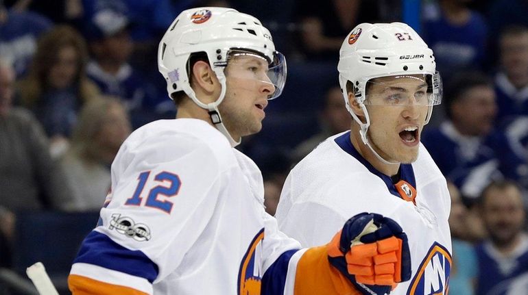 Islanders left wing Anders Lee celebrates his goal against the...