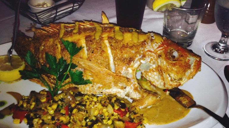 Crisp, whole red snapper highlights the menu at CoolFish in...