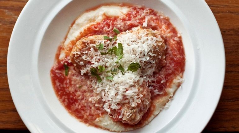 A plate of braised meatballs in a rustic tomato sauce...